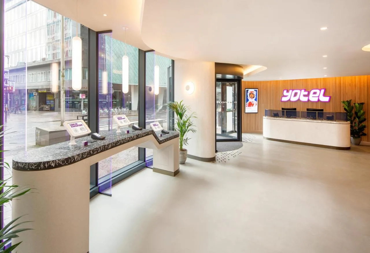 a lobby of a shopping center with a store at Yotel Glasgow in Glasgow